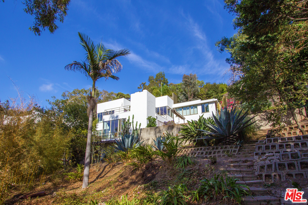 469 Upper Mesa Road Santa Monica, CA 90402 - Photo 2 of 33 a view of a house with a yard and potted plants