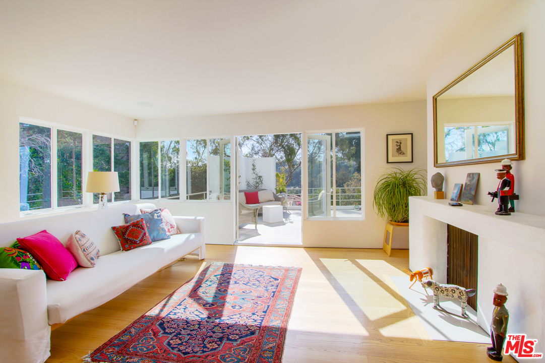 469 Upper Mesa Road Santa Monica, CA 90402 - Photo 13 of 33 a living room with furniture and a large window