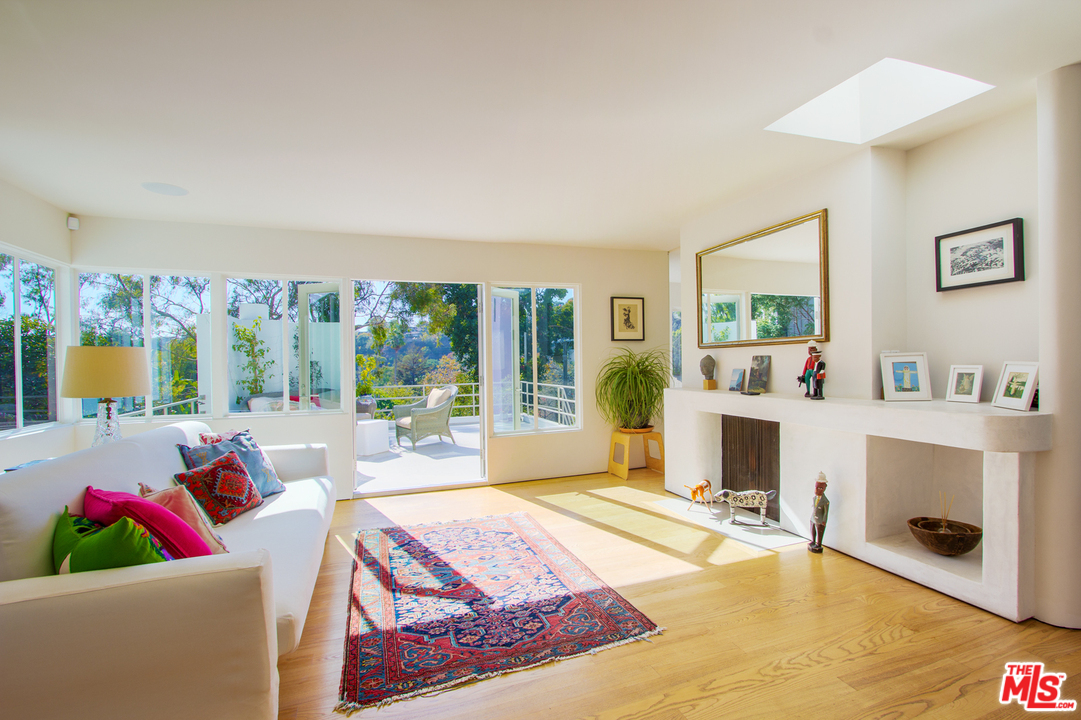 469 Upper Mesa Road Santa Monica, CA 90402 - Photo 14 of 33 a living room with furniture and a fireplace