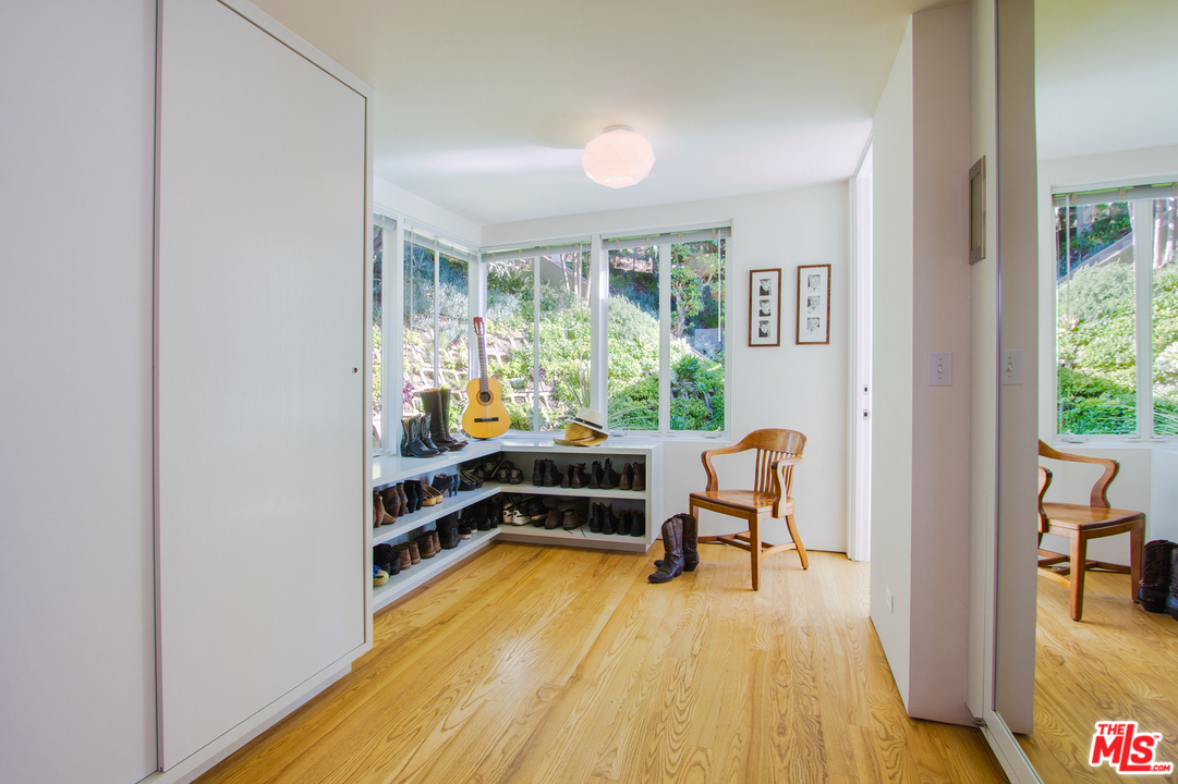 469 Upper Mesa Road Santa Monica, CA 90402 - Photo 17 of 33 a view of a bedroom with furniture and a window
