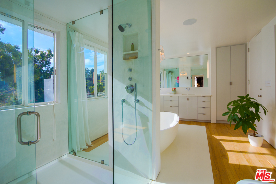 469 Upper Mesa Road Santa Monica, CA 90402 - Photo 20 of 33 a spacious bathroom with a granite countertop shower