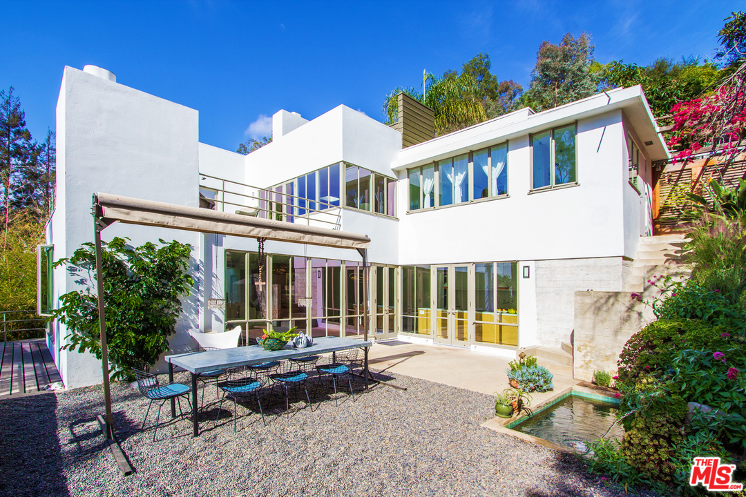 469 Upper Mesa Road Santa Monica, CA 90402 - Photo 3 of 33 a view of a building with a sitting area and garden