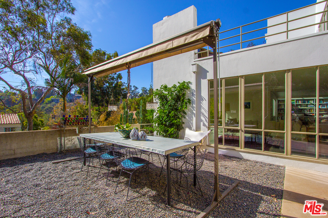 469 Upper Mesa Road Santa Monica, CA 90402 - Photo 26 of 33 a view of a house with backyard and sitting area