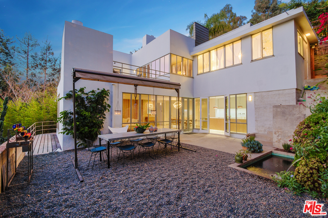 469 Upper Mesa Road Santa Monica, CA 90402 - Photo 30 of 33 a view of a house with backyard porch and sitting area