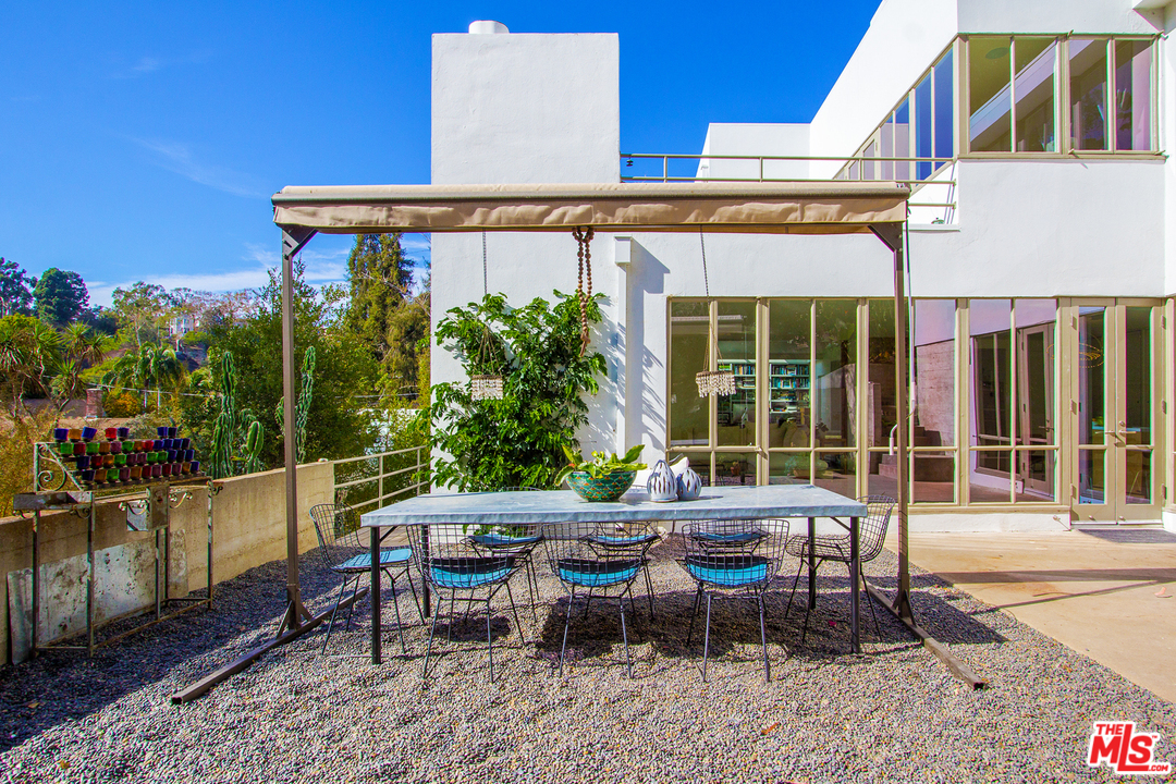 469 Upper Mesa Road Santa Monica, CA 90402 - Photo 4 of 33 a backyard of a house with outdoor seating