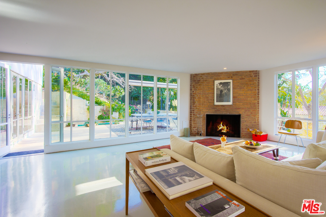 469 Upper Mesa Road Santa Monica, CA 90402 - Photo 7 of 33 a living room with furniture and a fireplace