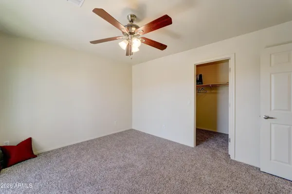 a view of a dry yard with a house