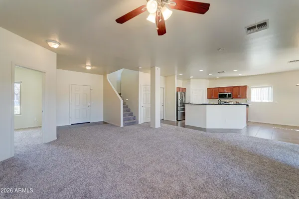 a view of a livingroom with a kitchen
