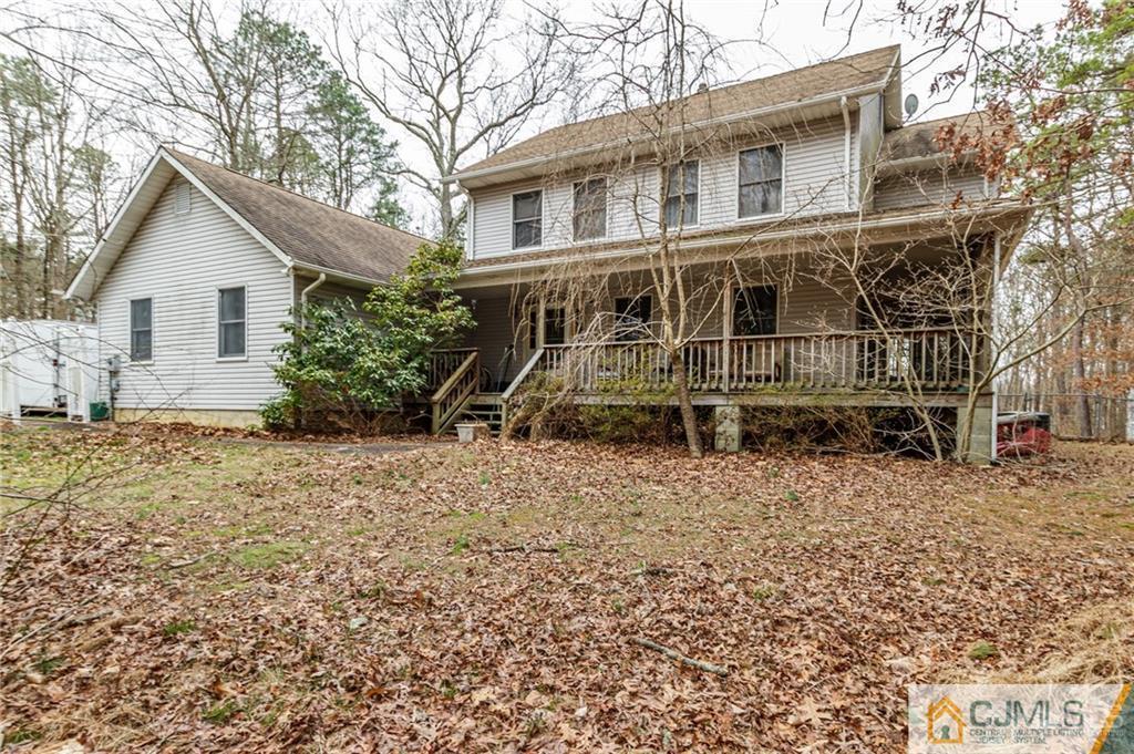 434 Burke Road Jackson, NJ 08527 - Photo 1 of 27 a view of a house with a yard and large trees