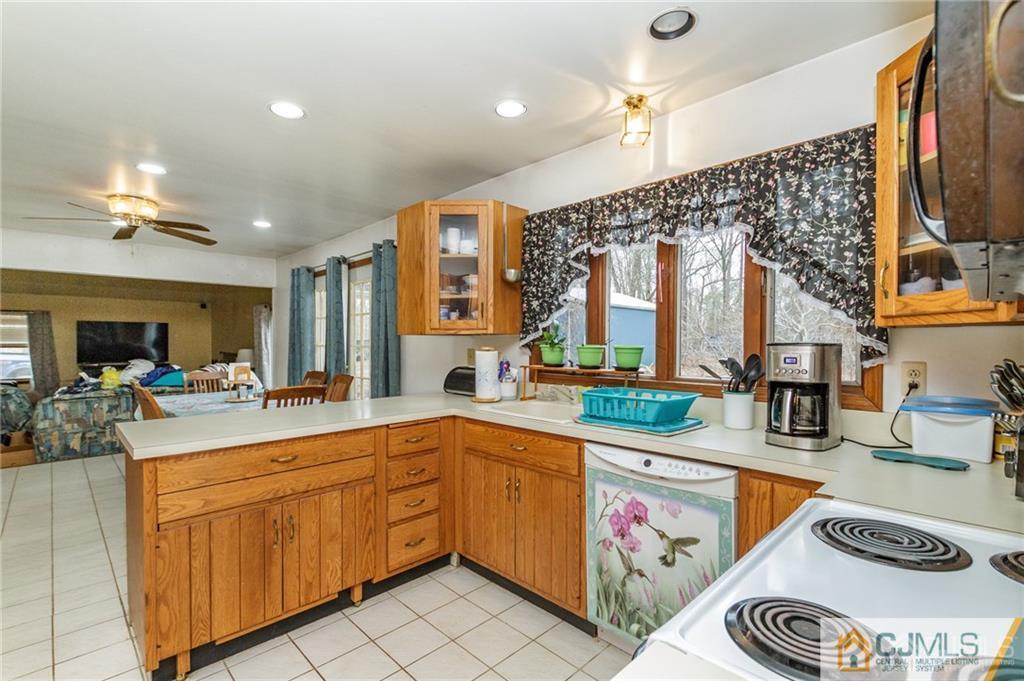434 Burke Road Jackson, NJ 08527 - Photo 11 of 27 a kitchen with a sink stove and cabinets