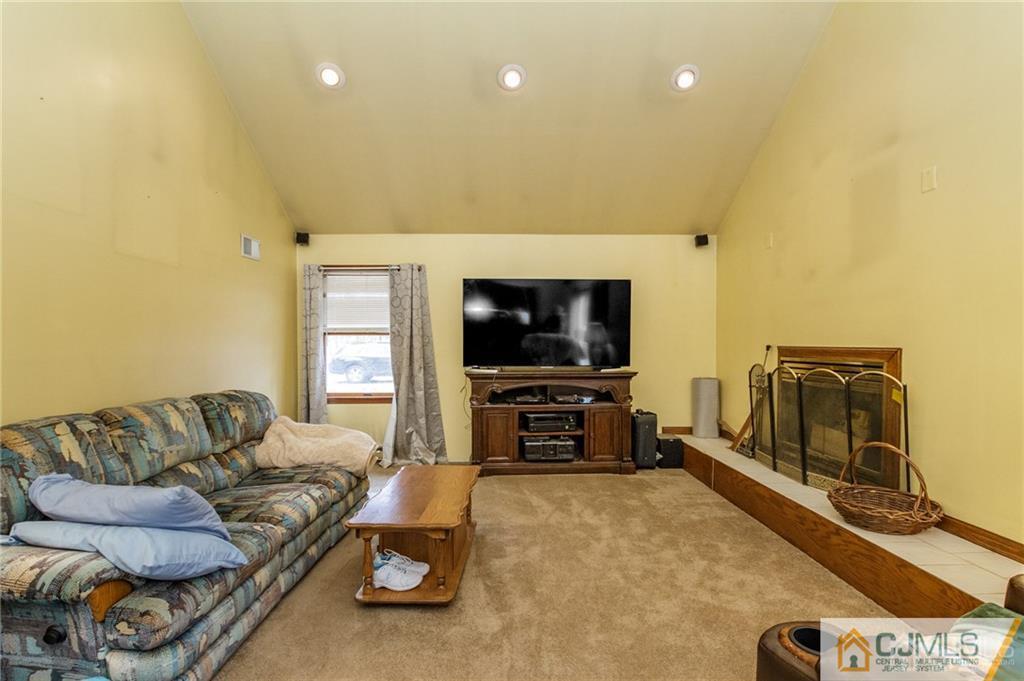 434 Burke Road Jackson, NJ 08527 - Photo 12 of 27 a living room with furniture and a flat screen tv