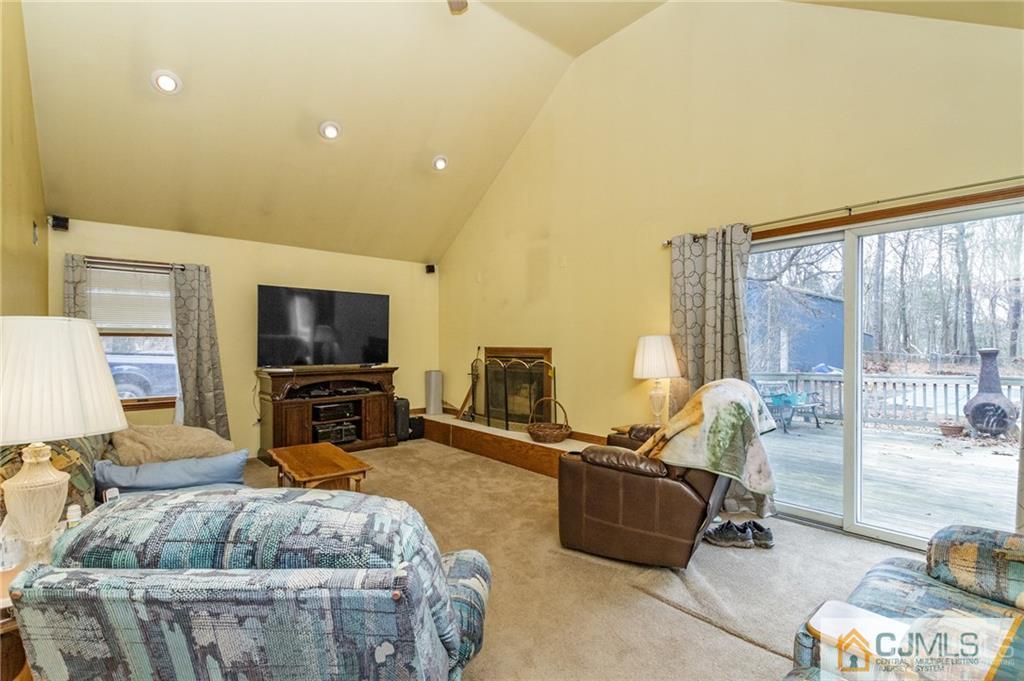 434 Burke Road Jackson, NJ 08527 - Photo 13 of 27 a living room with furniture and a flat screen tv
