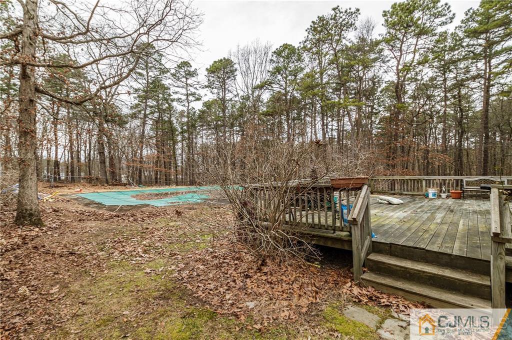 434 Burke Road Jackson, NJ 08527 - Photo 26 of 27 a view of a yard with wooden fence and a bench