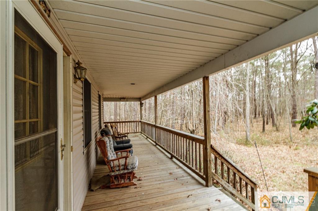 434 Burke Road Jackson, NJ 08527 - Photo 3 of 27 a view of two chairs in the balcony
