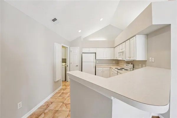 a view of a kitchen with a sink and dishwasher