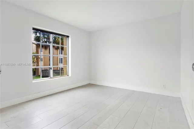 a bathroom with a sink toilet vanity and shower
