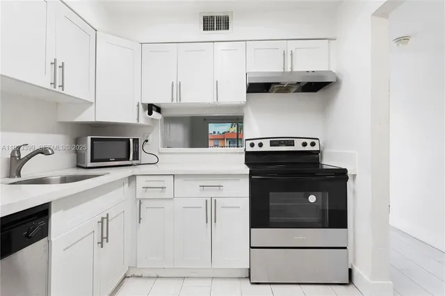 a view of an empty room and window