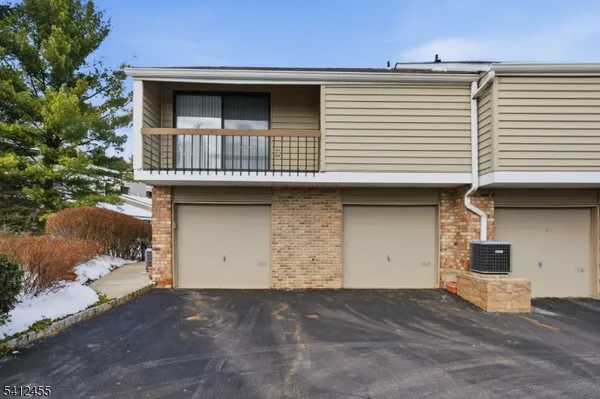 a front view of a house with garage