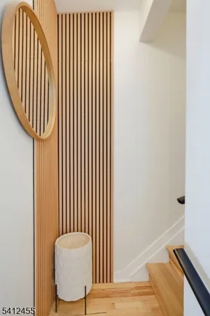 a view of a room with wooden floor and windows
