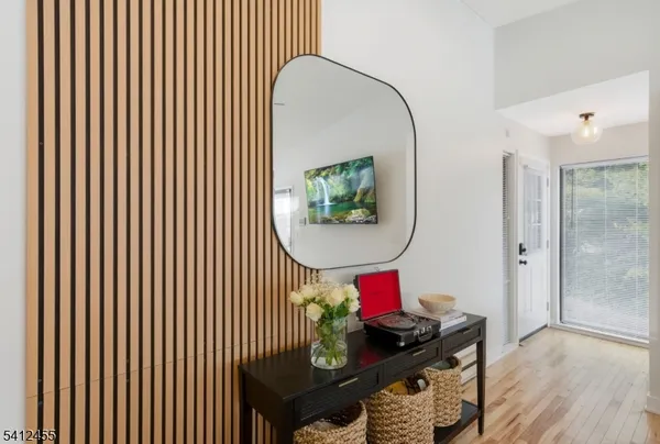 a living room with lots of furniture and a flat screen tv