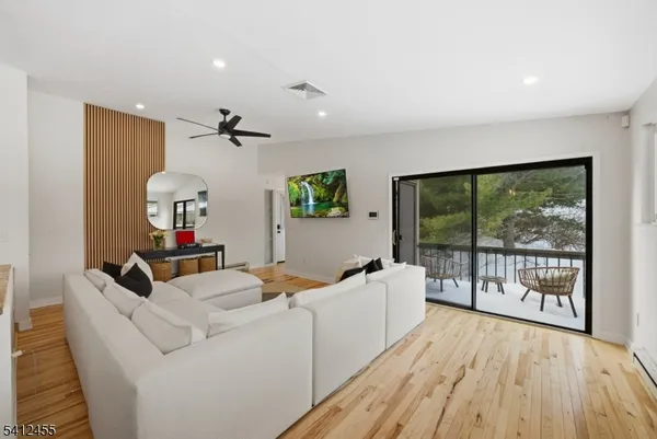 a kitchen with stainless steel appliances granite countertop a sink and dishwasher a stove with wooden floor