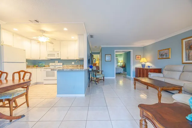 a lobby with furniture and rug