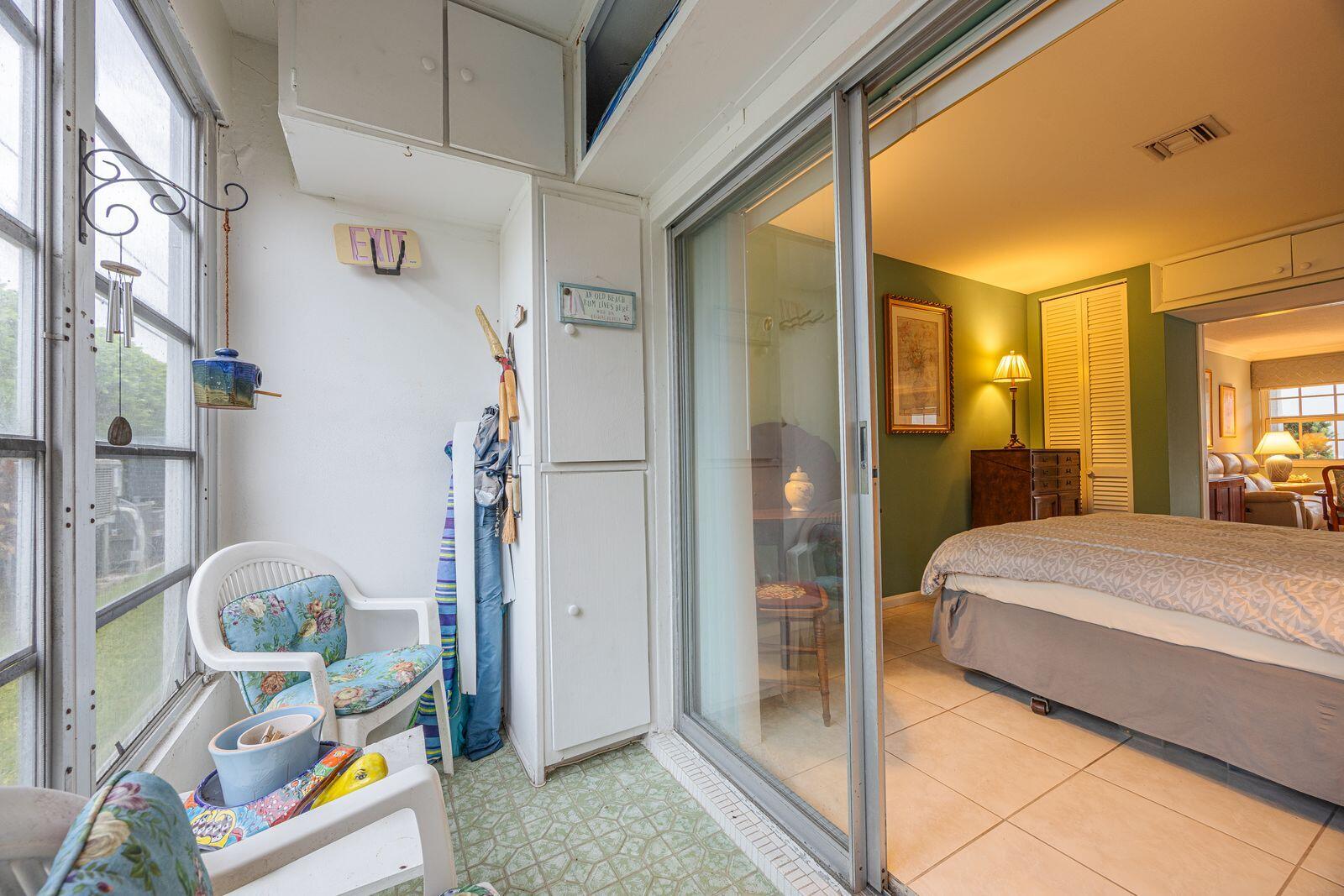 5505 North Ocean Boulevard, Unit 8108 Ocean Ridge, FL 33435 - Photo 11 of 22 a bedroom with a bed and a mirror