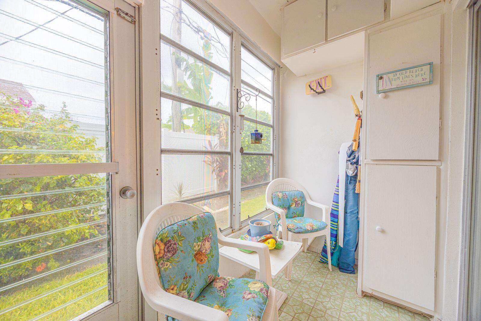 5505 North Ocean Boulevard, Unit 8108 Ocean Ridge, FL 33435 - Photo 12 of 22 a living room with furniture and a table
