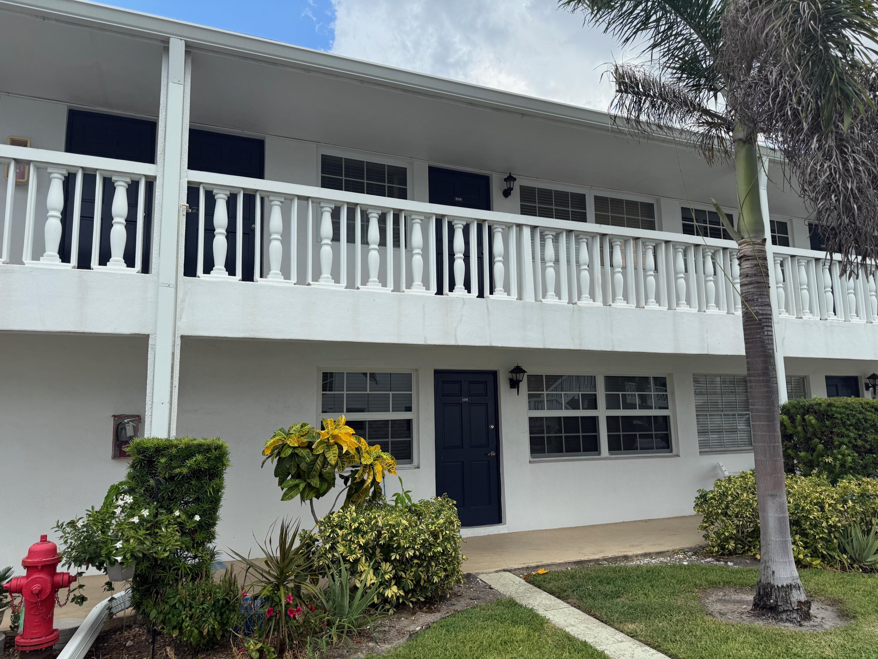 5505 North Ocean Boulevard, Unit 8108 Ocean Ridge, FL 33435 - Photo 20 of 22 a front view of a house with garden