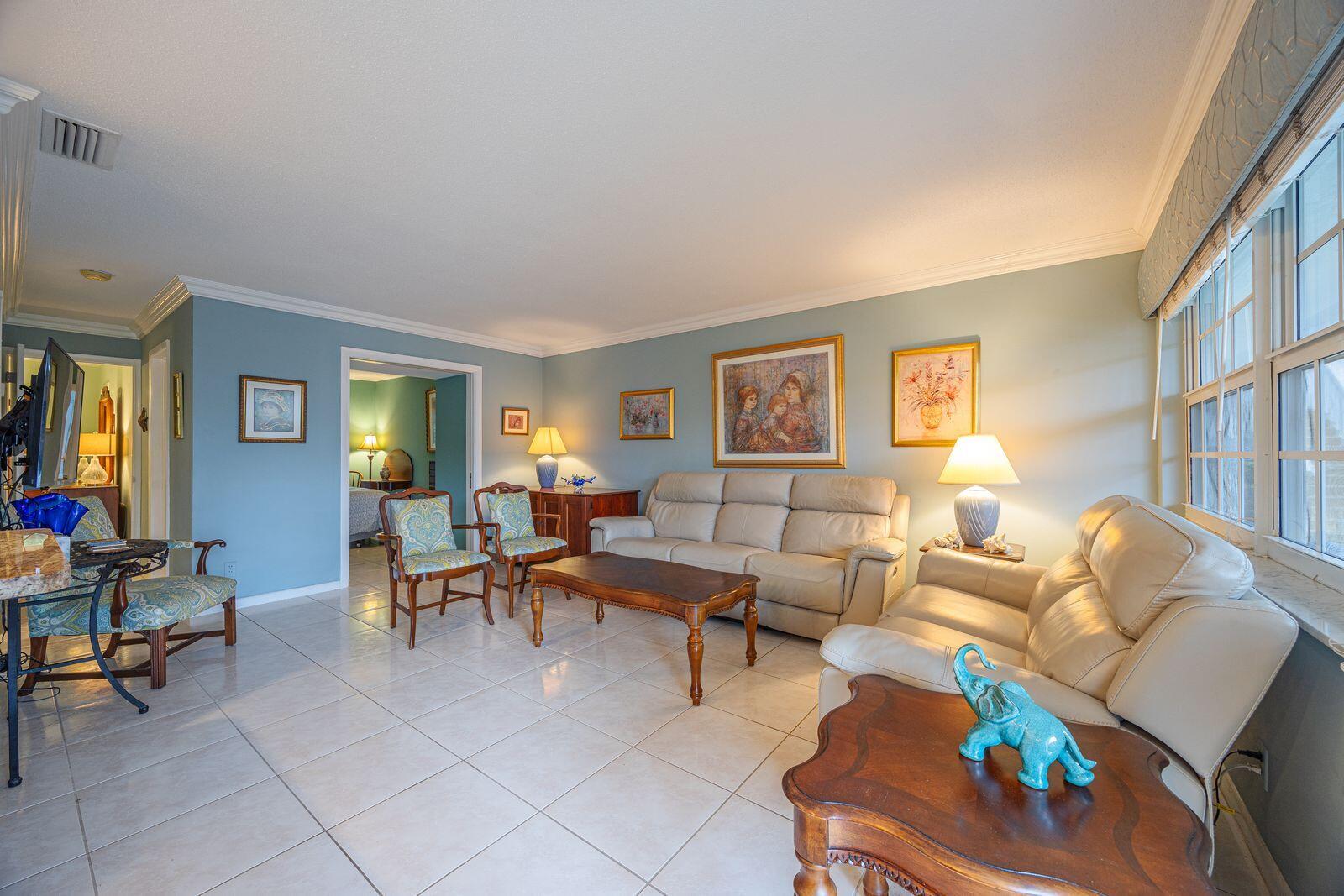 5505 North Ocean Boulevard, Unit 8108 Ocean Ridge, FL 33435 - Photo 2 of 22 a living room with furniture and a window
