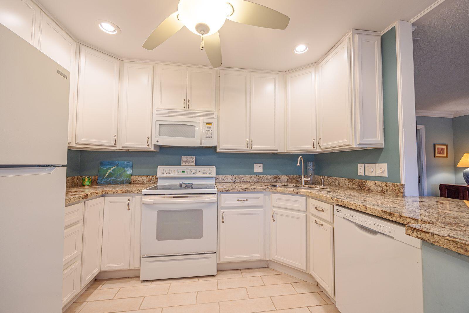 5505 North Ocean Boulevard, Unit 8108 Ocean Ridge, FL 33435 - Photo 4 of 22 a kitchen with cabinets appliances and a sink