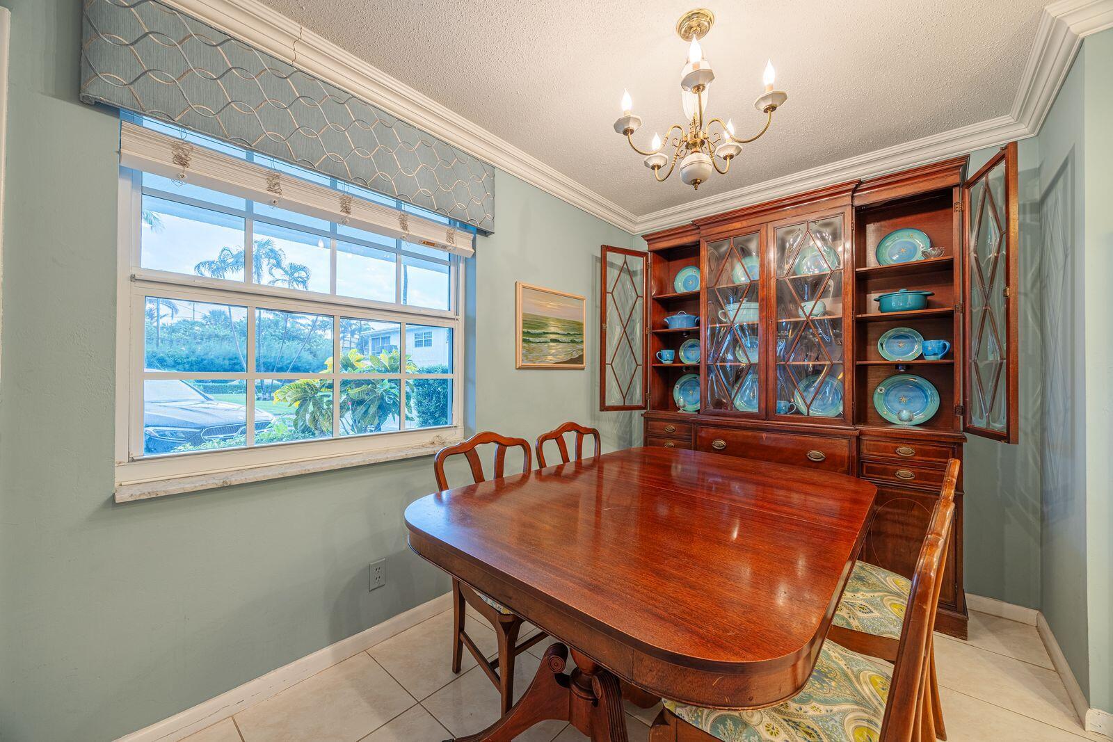 5505 North Ocean Boulevard, Unit 8108 Ocean Ridge, FL 33435 - Photo 5 of 22 a dining room with furniture and window
