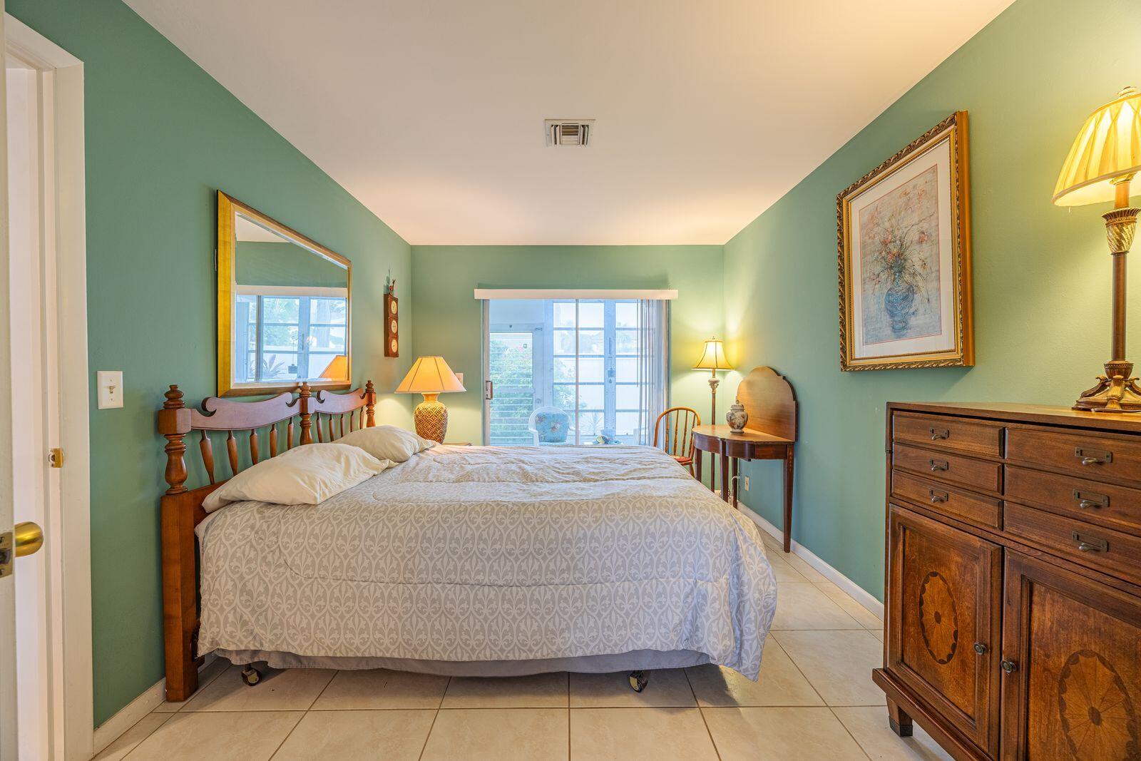 5505 North Ocean Boulevard, Unit 8108 Ocean Ridge, FL 33435 - Photo 9 of 22 a bedroom with a bed and window