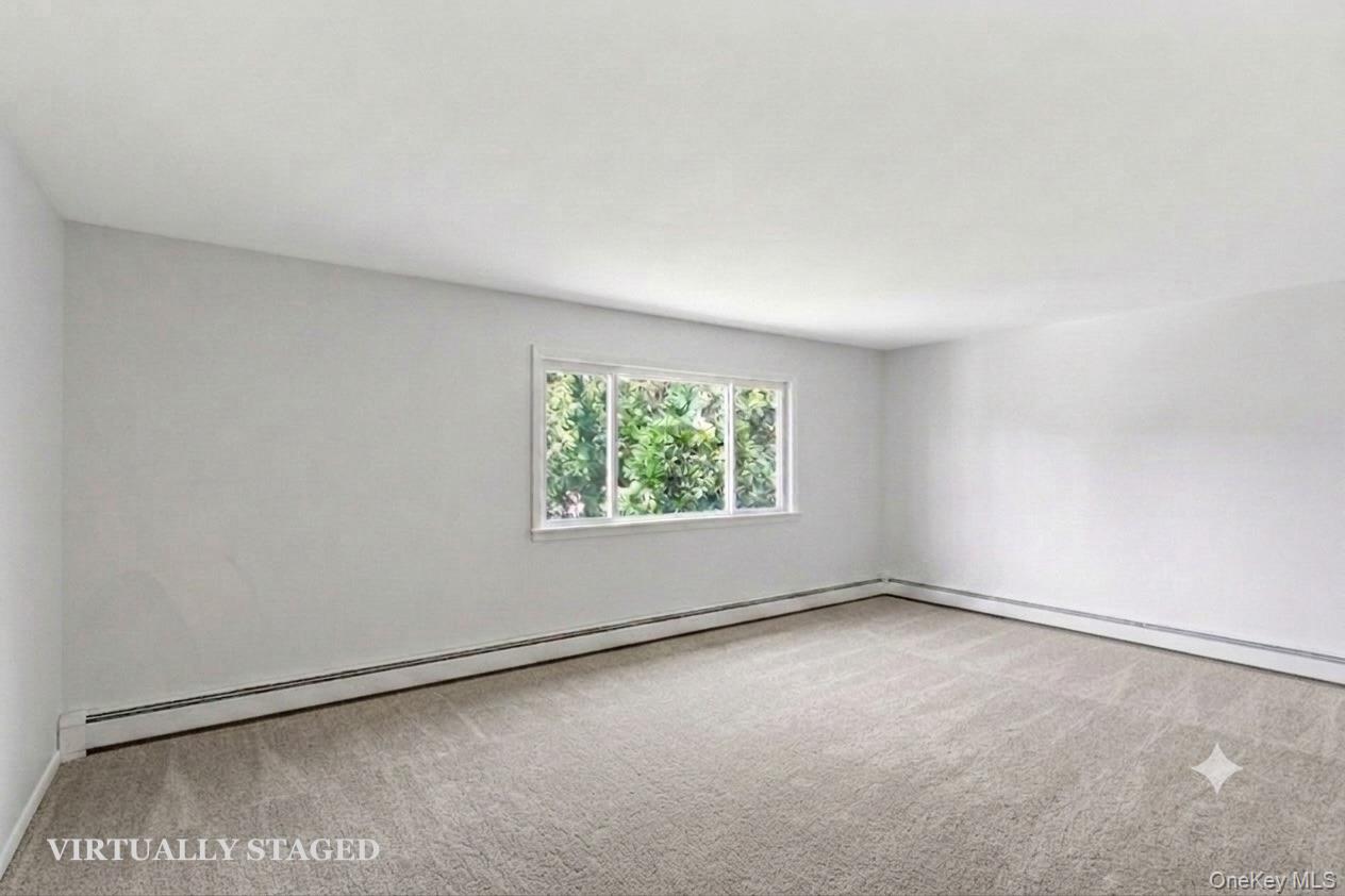 508 New Rochelle Road, Unit 2 Bronxville, NY 10708 - Photo 3 of 18 Living Room - virtually staged to show empty with new carpeting