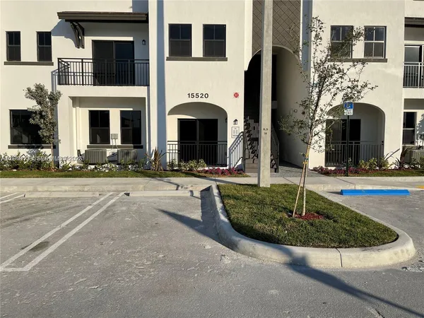 a front view of a house with yard