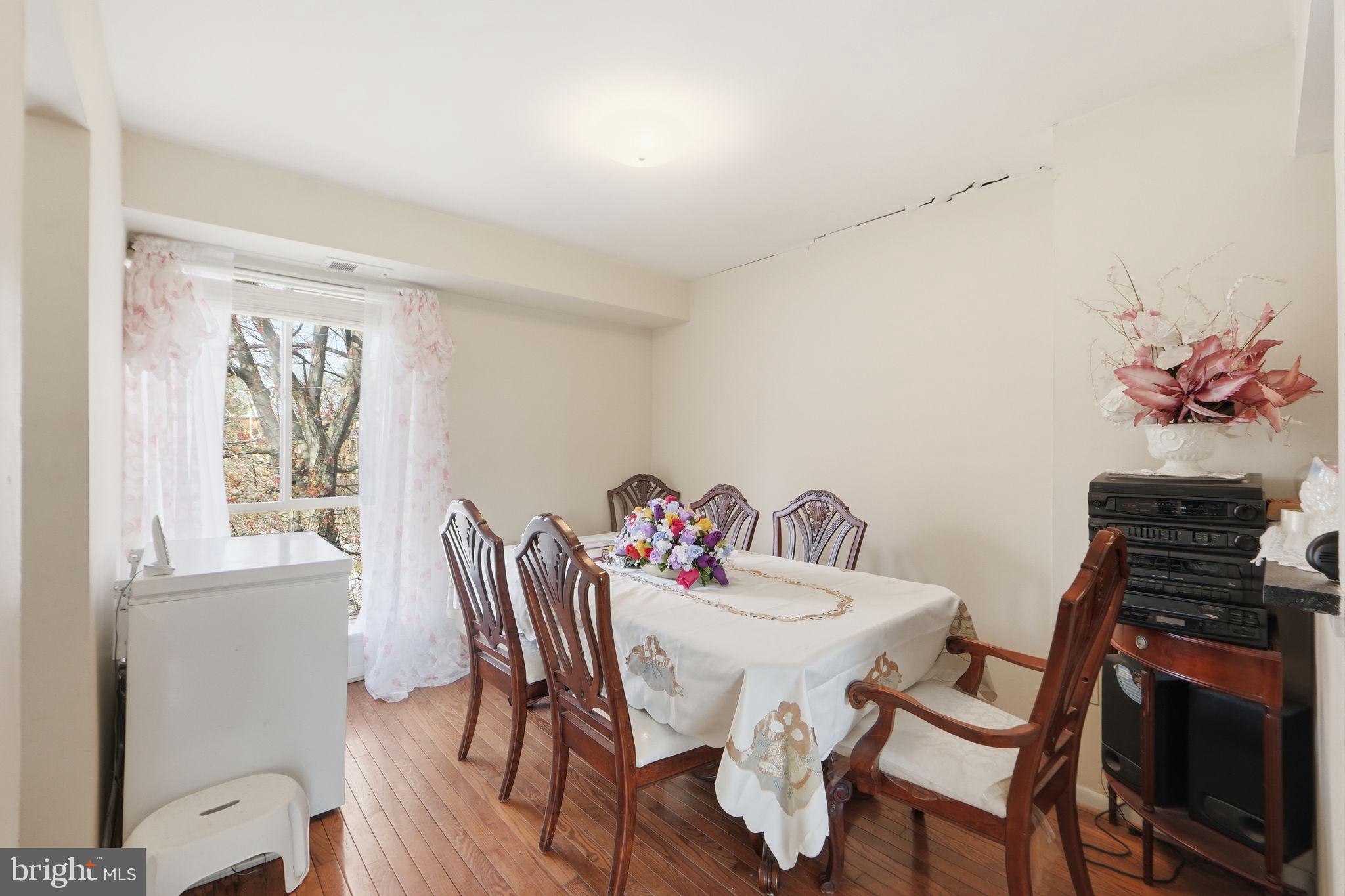 17805 Buehler Road, Unit 3 Olney, MD 20832 - Photo 12 of 30 a view of a dining room with furniture wooden floor and a window