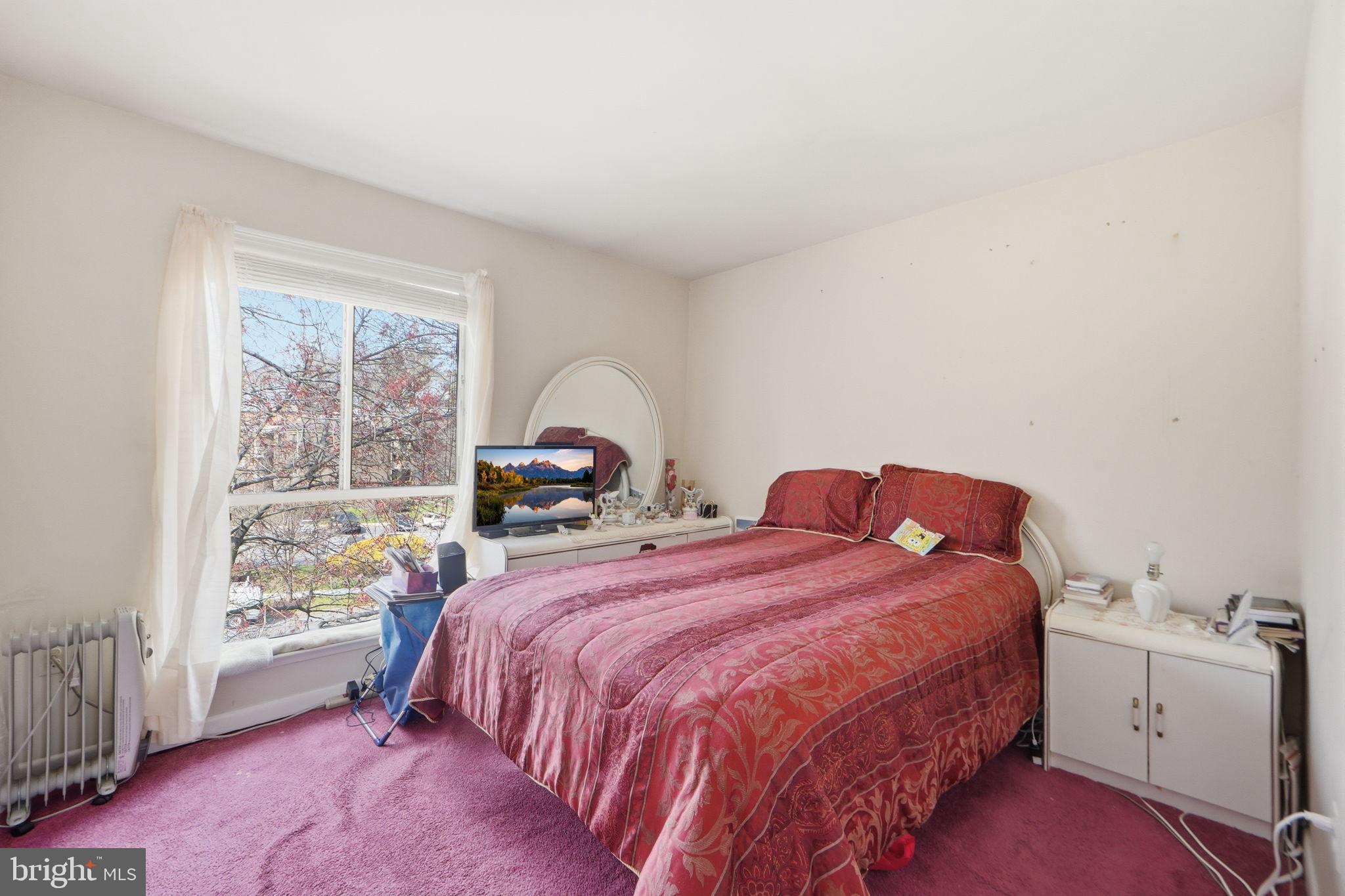 17805 Buehler Road, Unit 3 Olney, MD 20832 - Photo 23 of 30 a bedroom with a bed and a window