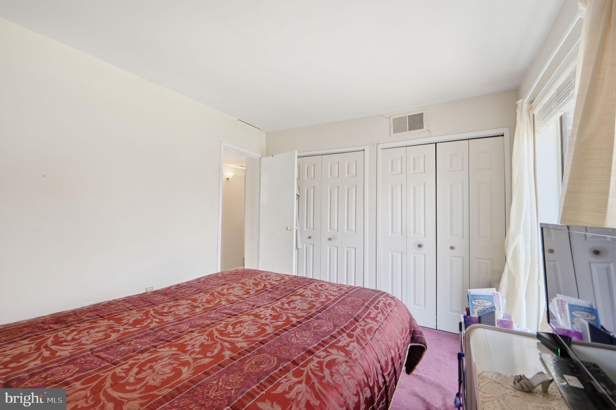 17805 Buehler Road, Unit 3 Olney, MD 20832 - Photo 24 of 30 a bedroom with a bed and a window