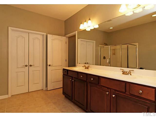 4604 Zaldivar Way Raleigh, NC 27612 - Photo 11 of 23 The Master Bath has a double-vanity, tile floors, a separate shower and tub, a large mirror and a huge master closet. Master Bath/Spa