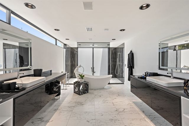 a large bathroom with a double vanity sink double vanity and bathtub