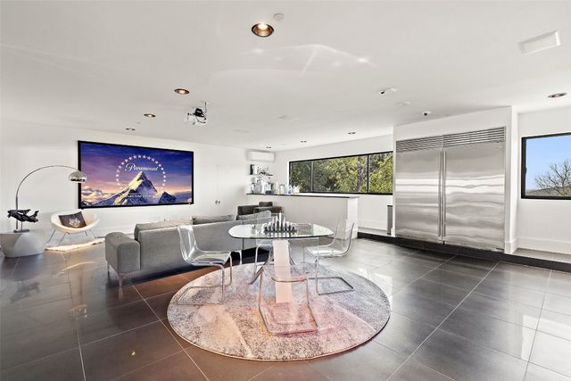 a view of a living room and dining room