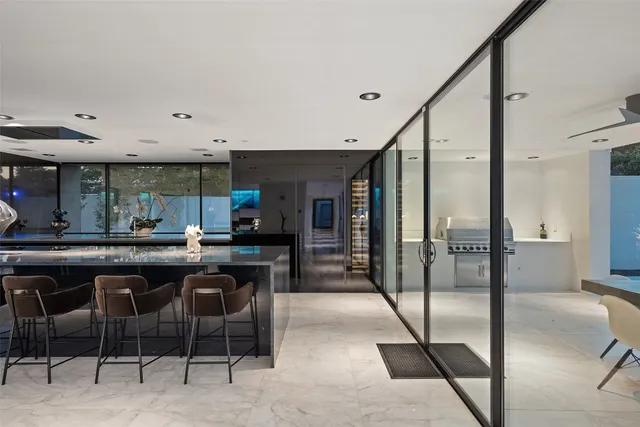 a kitchen with a table and chairs