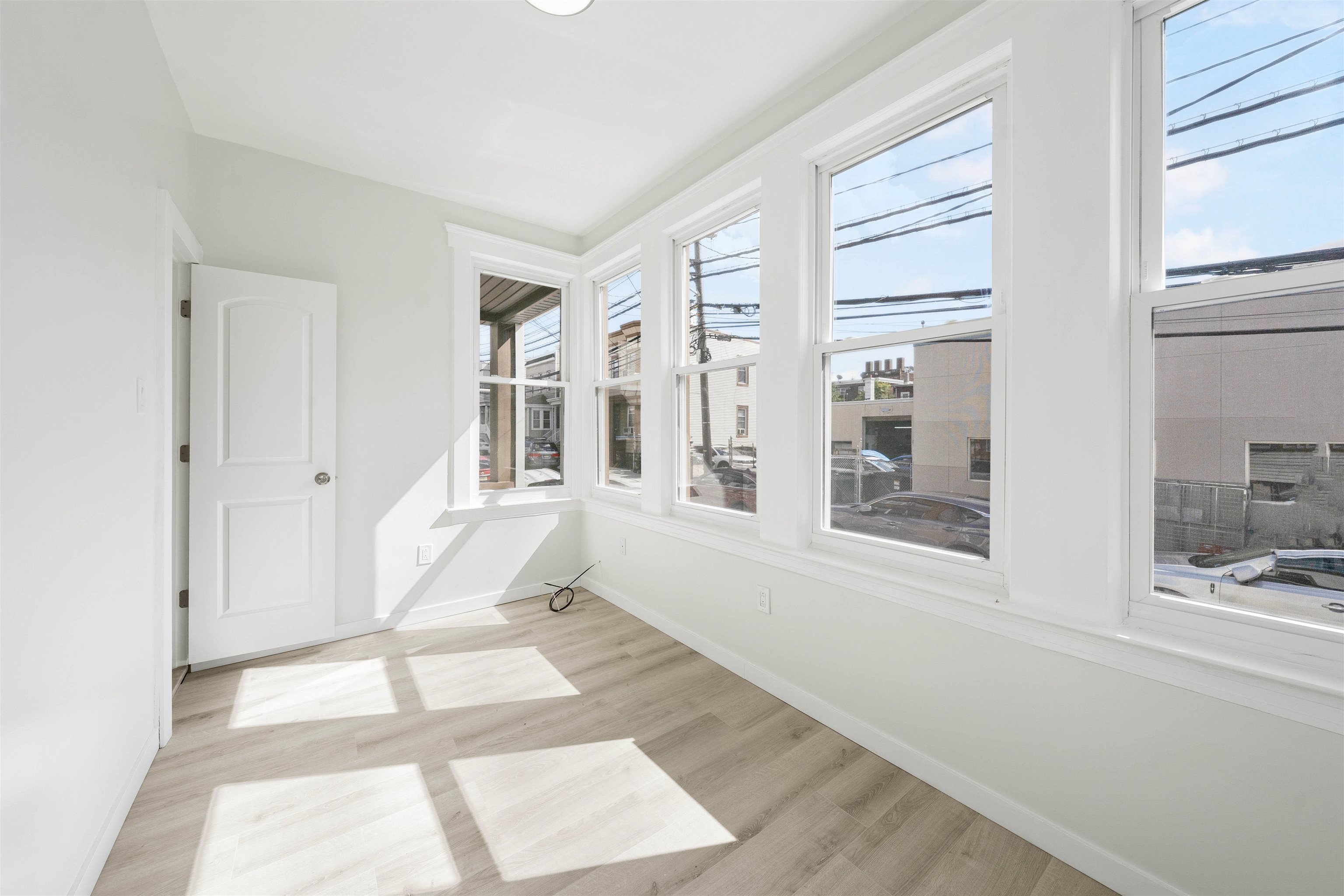 600 67th Street, Unit 1 & LL West New York, NJ 07093 - Photo 13 of 29 a living room with furniture and a floor to ceiling window