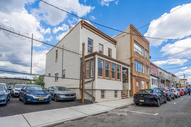 a view of a car park in front of house