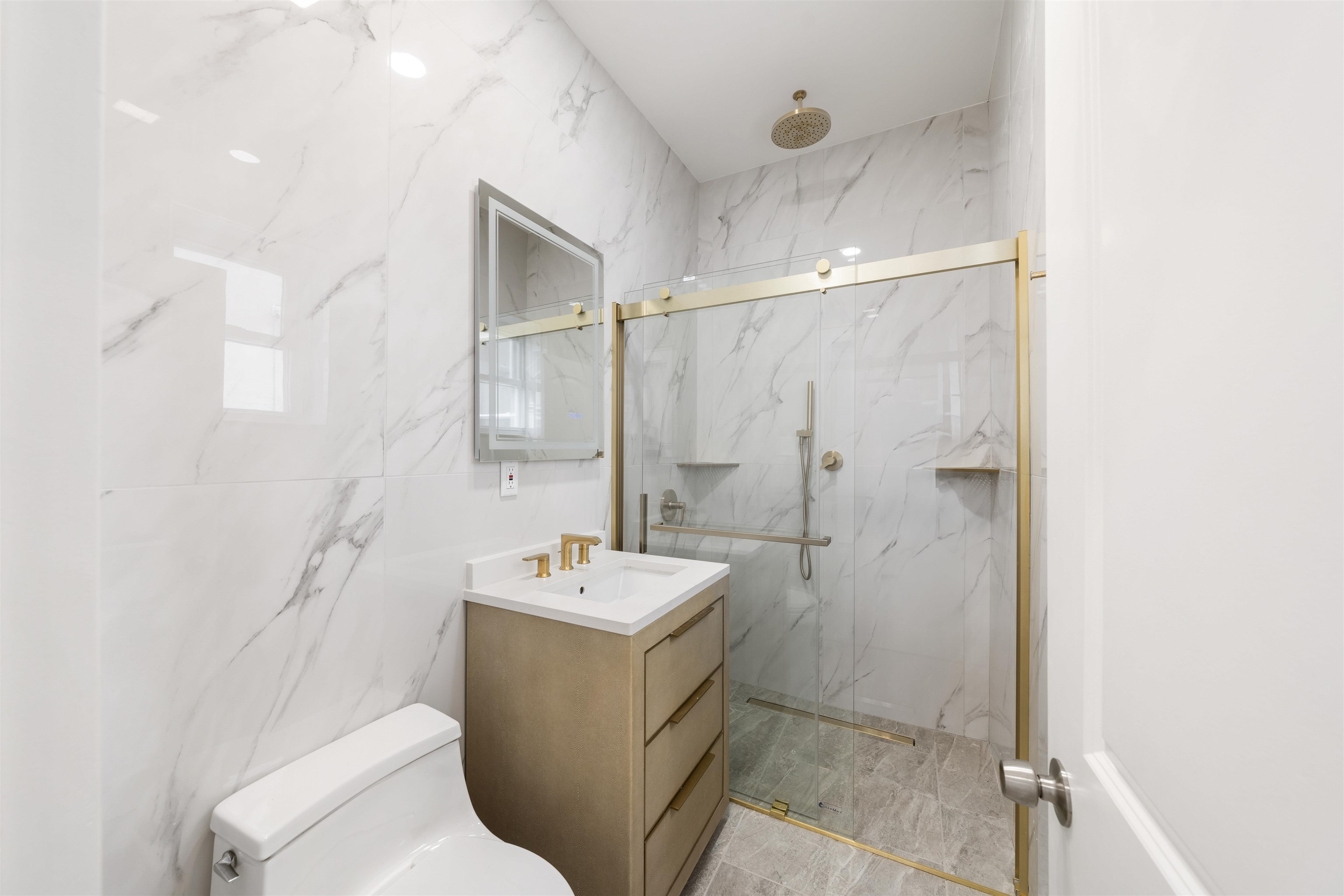 600 67th Street, Unit 1 & LL West New York, NJ 07093 - Photo 5 of 29 a bathroom with a sink toilet and shower