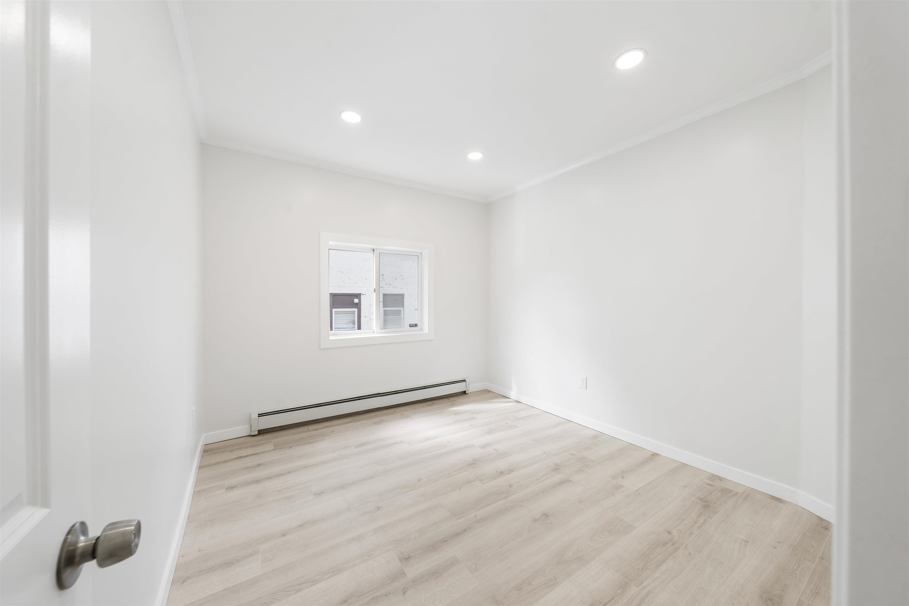 600 67th Street, Unit 1 & LL West New York, NJ 07093 - Photo 7 of 29 a view of an empty room with wooden floor