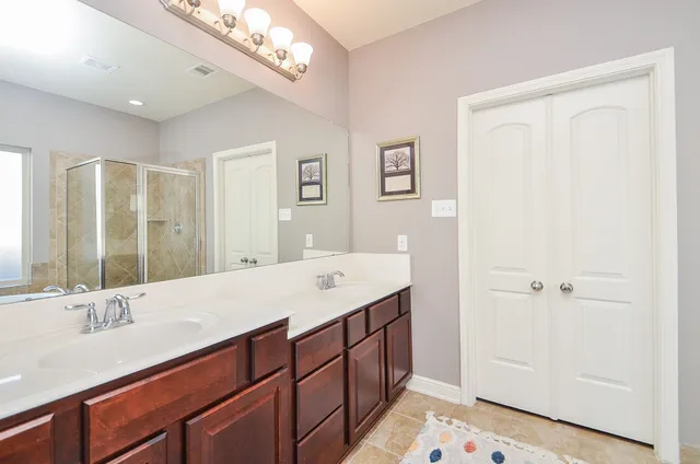 a bathroom with a sink a vanity and a mirror
