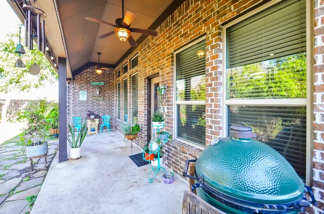a backyard of a house with outdoor seating