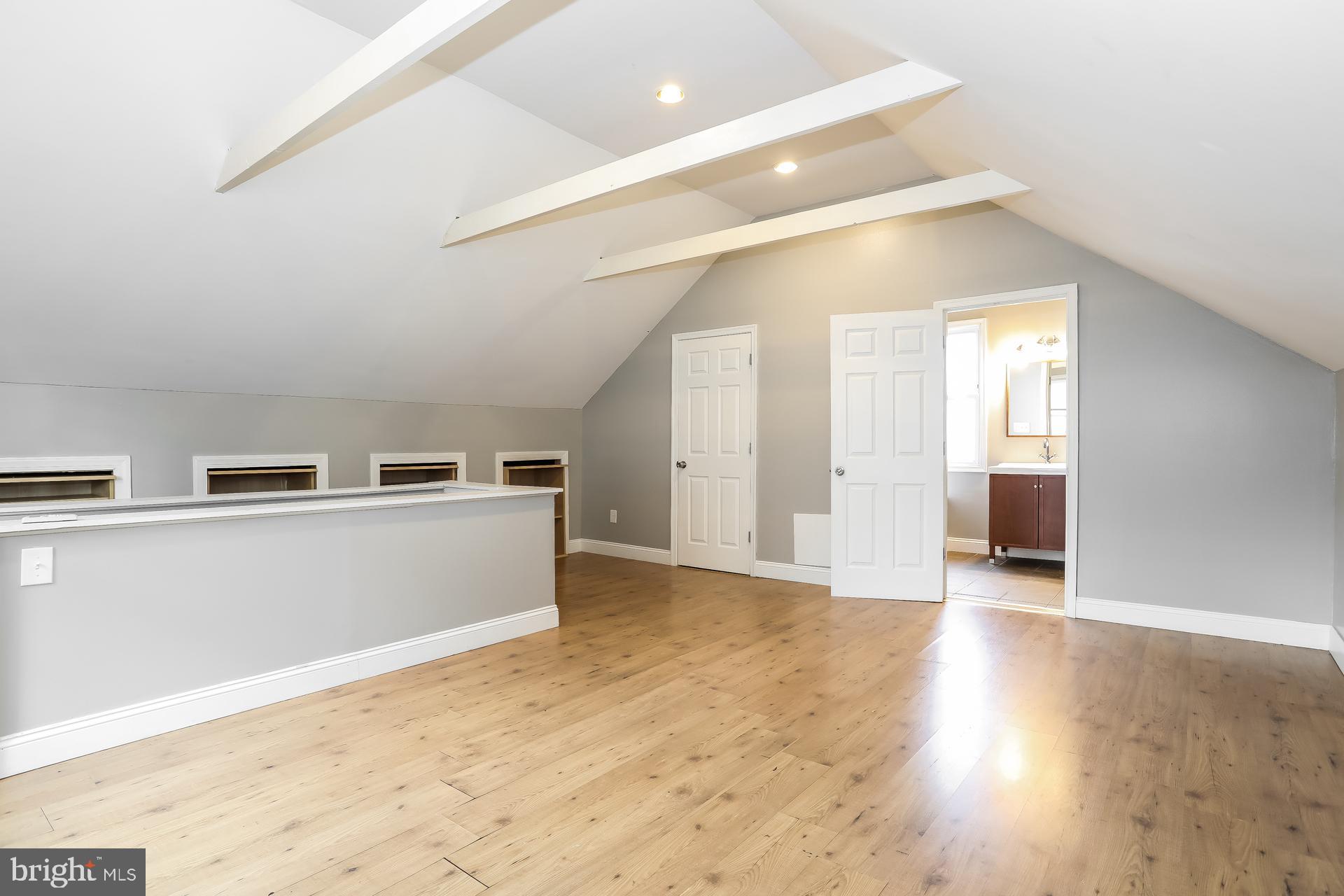 6207 Eastern Parkway Baltimore, MD 21206 - Photo 12 of 15 a view of a kitchen with wooden floor and electronic appliances