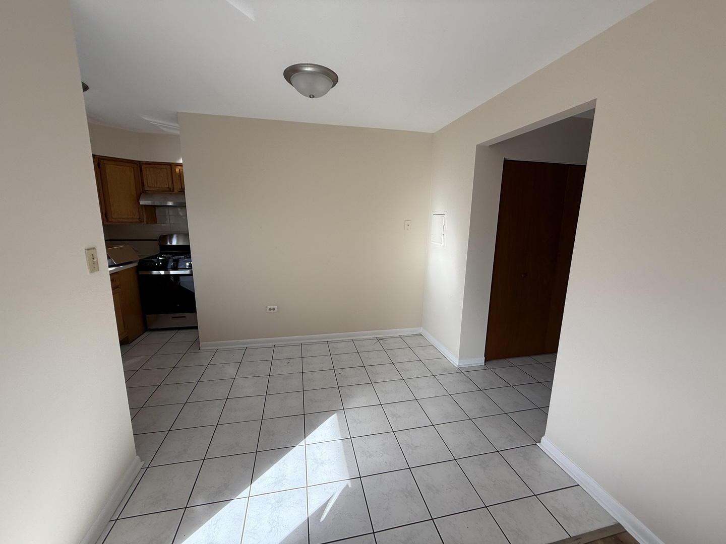 5758 35th Street, Unit 201 Cicero, IL 60804 - Photo 8 of 9 a view of an empty room with a stove